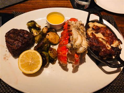 Guests enjoy various cuts of steak, fresh seafood (including award-winning crab cakes) & other house made favorites like the Maytag Bleu potato chips & Chocolate Velvet Cake. . J gilberts woodfired steaks seafood st louis photos